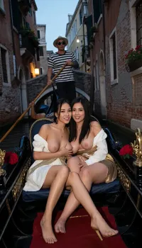 This image shows a happy lesbian asian couple enjoying a gondola ride through a narrow canal in Venice, Italy. Two lesbian women, 21yo, They are sitting close together on the gondola, with the woman leaning affectionately on her shoulder. Both are smiling and appear relaxed and content. The gondolier is in the background, dressed in a traditional striped shirt and wearing a hat and sunglasses, is standing at the back of the gondola, skillfully steering it with a long oar. The canal is flanked by old, charming buildings with weathered brick walls and flower boxes on the windows. In the background, a small stone bridge arches over the canal, adding to the romantic and picturesque atmosphere of the scene. The overall mood is one of leisure, romance, and the enjoyment of a classic Venetian experience. They wearing a venetian Historical period costume, at night, Lanterns flicker on the buildings, (scene, full moon, Moonlight, cool and soft, mystical, serene, night-time, tranquil, moonlight reflects off the water), dresses unbuttoned and breasts popping out of dress, gently caressing each others breasts, one girl spreads her slightly her legs and shows her pussy, Sensual, short, petite, slender, beautiful, seductive long black hair, big perky breasts, perfect makeup, 34c boobs, High detail, excellent image quality, they are models, wearing golden highheels