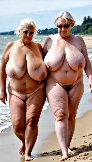 Uma imagem pornográfica de duas velhas obesas velhas mulheres peludas com enormes mamas monstruosamente andando pela praia, nua.