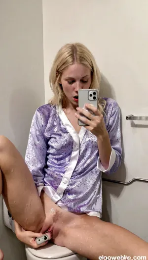 --style raw, -no text, -no watermarks, one 30 years old skinny swedish blonde girl in a toilet of a disco bar, white walls, caught masturbating, she is watching her mobile phone, pijama, intense orgasm expression, Detailed, natural, skin, and, blemishes, without-makeup, acne, <lora:skin_4-000015:.5>