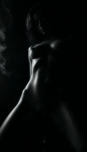 (masterpiece, best quality, photorealistic), ((monochrome:1.6)), ((black and white only:1.5)), ambient void lighting, deep shadowed black room with no walls, pure negative space woman standing fully nude in the center, legs slightly apart, posture still and powerful, ((cum-slick pussy dripping slowly:1.6)), thighs streaked, fluid trailing toward the floor, ((smoke billowing from her skin:1.7)), rising in soft strands from her shoulders, belly, and cunt, glowing faintly in contrast, ((eyes glowing deep red:1.5)), locked forward, calm and haunting—gaze of something no longer human skin glistening with sweat, body still trembling from recent orgasm, mouth slightly open camera positioned low and frontal, focused on the glistening between her thighs, the smoke rising, and her burning stare atmosphere dead silent, sacred and violated—she is the altar, the flame, and the ash, ((selective color, red)), <lora:ral-chrosc-bw:1>, <lora:dark:1>