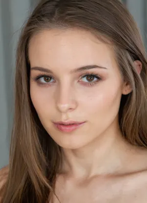 A highly detailed and realistic portrait of a young woman with an intelligent but attractive and seductive appearance, She has a delicate face, smooth fair skin and long, straight brown hair in disarray. Her eyes are expressive, giving her a sophisticated and slutty look.