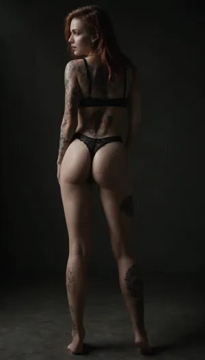 Emo girl, not fit, 75 kilos, One meter and sixty centimeters tall, piercing in the mouth and nose, several earrings in the ear, long hair, ginger, red Head, very hairy pussy, purple lace panties and bra, Colorful dragon tattoo that starts on your ankle, goes down your leg and back ending on your shoulder., dragon, back, full, body, tattoo, <lora:DragonTattoo:.8>, <lora:FBT-000002:.8>, <lora:dark:.2>