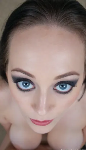 Goth girlfriend, naturally sagging breasts, nude, exposing herself to the camera, sensual erotic close up of her face, intense blue eyes, black makeup