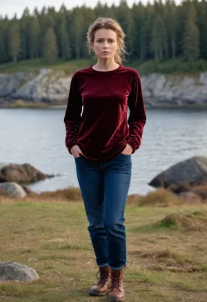 (masterpiece, best quality:1.2), 1 girl, swedish film character Linda Wallander, solo, (blue jeans, hiking boots:1.2), (wears an shimmering dark chestnut velvet wide round neck shirt, baggy shirt with puffed sleeve:1.4), outdoors, dark blonde hair, bright ice blue eyes, shoulder lenght hair in short ponytail or or chignon hair, standing in early spring swedish landscape on Baltic Sea beach, sunrise over the sea, she looks into the distance, serious look, photorealism