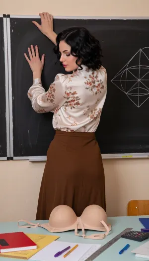 average czech Mature woman according 1980s standards, 1980s style, 30YO, retro short curly black hair, retro, with big nose, vintage, (wide hips), retro 1980s, USSR Epoch, late 1930 USSR beauty standards. 1980s class room, retro tables, retro black board. wearing vintage a long-sleeved silk blouse with flower pattern, a brown long skirt. shy and sexy posing. shy smirk, on the black boar are some geometry objects . on the table are placed some notebook, books, pens, pencils, linear, calculator. looking through table. woman is standing in front of black board beige bra size placed on table, detailed bra. small saggy breasts, with back to black board, hands grabbing top of black board, arched back