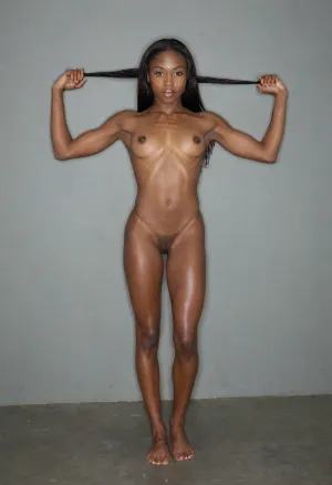 Beautiful female jamaican athlete, woman sprinter, muscular shoulders and arms, small tits, extreme dark skin, nude, <lora:Thigh_gap_SDXL:.8>