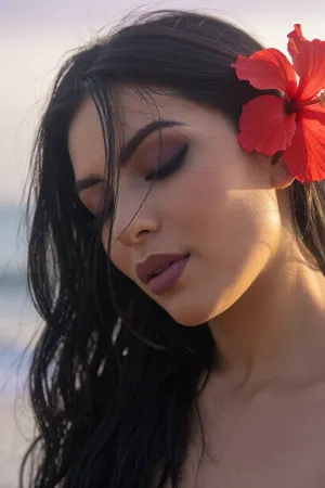 A tight intimate closeup portrait of a sultry Latina woman with an ethereal, soft-focus aesthetic, defined by diffused light. The Mexican woman's long elegant dark hair falls loosely across her face and obscures her sultry facial features while coyly hiding one eye behind the thick cascade of luxurious hair, a hibiscus flower is tucked behind her ear.
Long feathery eyelashes and dark smokey eye shadow with bold eyeliner.
Her luscious lips are a dark matte berry with soft pillowy creases. She has prominent sharp cheekbones.

The scene is enveloped in a powerful but diffused golden-hour glow from the side, which creates a luminous light bloom on her skin, dissolving sharp edges in an ethereal haze. The background is a very blurred, dreamlike pastoral pastel lavender-gray coastal sky, soft and bright. Soft focus on her luscious kissable lips.
The overall mood is an intimate serene sensuality. Shallow depth of field, subtle film grain, light leaks, vintage analog lens. This is a high-key photograph.
The subject is anchored to the right side of the image, using the rule-of-thirds compositional technique.