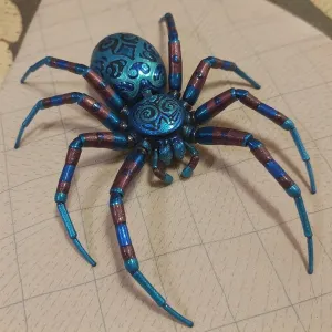 One spider, intricately engraved patterns on exoskeleton. Exoskeleton Metallica emerald blue green with segments of metallic ruby red luminescent, crayon drawing