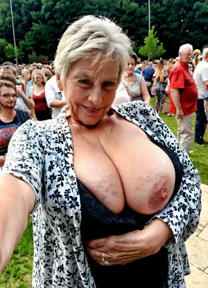 Real grandmother with oversized massive breast takes a selfie with her youngest girl, real grandmother style, perfect granny's body and face, lascivious pose, outdoor, full clothed, open shirt High detailed photo, high quality photo, crowd, ordinary grandmother