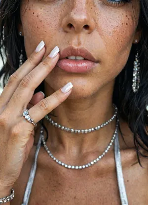 (masterpiece, high quality, cinematic, 8k, UHD, high realism, highest detail), beautiful 18 year old girl, (very puffy dark areolas:1.4), (close-up at nails:1.6), (long black hair:1.5), blue eyes, freckles, huge saggy breasts, skinny, (silver micro skirt), (silver micro bikini top:1.4), (nipple slip:1.2), black silk stockings, gladiator very high heels, one leg knee, colourful bracelets, colourful necklaces, dark tan skin, natural lipstick, colourful rings, (perfect manicured very long polish nails:1.4), diamonds choker, hairy pubis, (lots of long silver necklaces:1.3), (((she wear lots of extremely detailed silver and diamonds small rings in every finger:1.5))), but, <lora:BUT_SDXL_SHS:.8>, <lora:LCMTurboMix_Euler_A_fix:.3>
