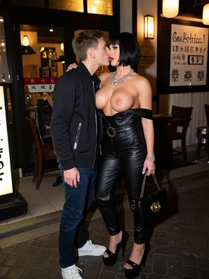 Selfie photo, In the night street restaurant in japan, a young 18‑year‑old guy, a 45‑year‑old woman, Russian porn star, She has sexy, bold makeup, full lips, bob cut black hair with bangs, very busty, black leather tracksuit, high platform heels, luxury jewelry, expensive bag.they kissing