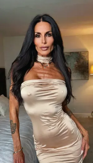 Lying on my bed pov, very slender body and muscular skinny, sexy hands, showing off lips, long dress, seductive face, skinny fit, anorexic, close up, (cowl neck dress), ((55yo old skin woman)), choker, tattoos, sexy neck, (tan skin), (fit body:1.3), (beautiful black hair Jewish milf instagram model face), (fit body), very beautiful, perfect skinny body, perfect face, looking at the camera, perfect eyes, (skinny fit), pretty, snub-nosed, long hair, bmbplora, veins, pump, up, <lora:bimboxl_02:.8>, <lora:clothed_small:1.8>, <lora:veins pump up lora.TA_trained:.8>, <lora:ThePitXL:.8>