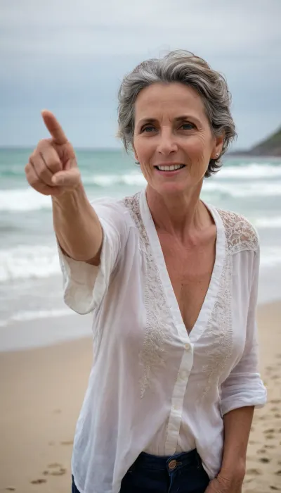 A mature woman pointing at me at the beach