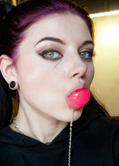 Breathtaking extremely junior very horny 19 year old American Goth girl, medium fake breasts out, athletic body, perfect skinny body sharp nose, smooth silky long hair rectangular face, wide mouth, full lips, dark makeup, black hair and pale skin, tattooed, expensive hairstyle, expensive earrings, beautiful necklace, thin eyes, green eyes, pale skin, freckles, big cheekbones, slim, deep dimples, cute chin, kind eyes, white teeth, detailed faces, <lora:SDXL_BetterFaces-LoRA_v1:.5>, Black eyeliner. Heavy bronze eyeshadow. BREAK
Fully clothed in, (hot pink baggy college hoodie:1.2), . realistic eyes. she sucks on a round red lollipop. Sultry expression. Tousled, high ponytail. Eye contact, (sultry), confident. Petite, athletic, sweaty. Photorealistic. Viewer at eye level, close up. In a poorly lit, rundown basement of a derelict building. Close up, macro shot, Canon RF 100mm F2.8L Macro IS USM, Kodak Portra 400 color film. Nostalgic, film-grain aesthetic., with an overall underexposure of 1-2 stops to accentuate the darkness and isolation of the environment. Close-up on face. Soft backlight.