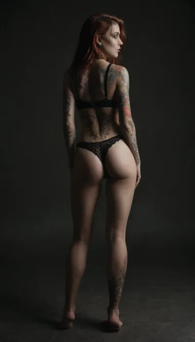 Emo girl, not fit, 75 kilos, One meter and sixty centimeters tall, piercing in the mouth and nose, several earrings in the ear, long hair, ginger, red Head, very hairy pussy, purple lace panties and bra, Colorful dragon tattoo that starts on your ankle, goes down your leg and back ending on your shoulder., dragon, back, full, body, tattoo, <lora:DragonTattoo:.8>, <lora:FBT-000002:.8>, <lora:dark:.2>
