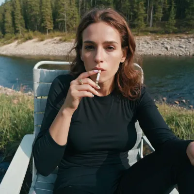 a ugly skinny trashy woman sitting in a chair smoking a cigarette, inspired by Nan Goldin, reddit, plein air, black spandex, near a river, milf, amateur, close up, hiking clothes