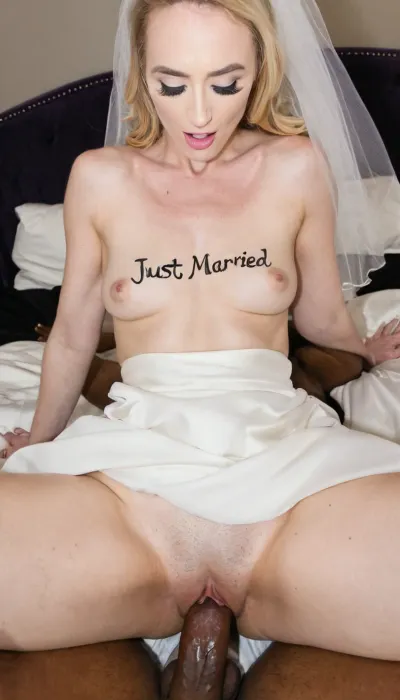 ((an innocent looking young white bride in wedding dress)), (the woman is riding a black man's big penis), ((the text "JUST MARRIED" is written on the woman's chest with a sharpie))