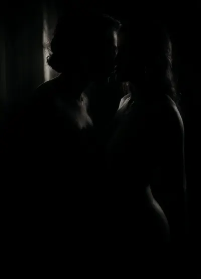 (1 mature woman about 40), (1 young guy 18), (mature mom:1.2), (woman has C-cup breasts, straight hair:1), very long hair, pink nipples and vagina, shaved pussy, dark brown hair and blue eyes, toned stomach, (no cellulite:1), pale marks from a swimsuit, elegant woman, soft wrinkles, mature beauty, slight fatigue, realistic aging, (average figure:.9), excited, wet pussy, (very handsome, seductive face:1), (Boy with a clean and smooth face, body with little muscle mass, very thin, very short:.9), (He sits in a soft chair with his legs dangling on the floor, she sits next to his feet, licking his erect penis, she looks at him:.8), detailed face, photogenic face, detailed Leather, 4K, hotel room, deep twilight, side view of a couple., (The woman is wearing cream-colored lace lingerie with stockings and a silk robe, the hem of the robe is open:.9), <lora:dark:2>