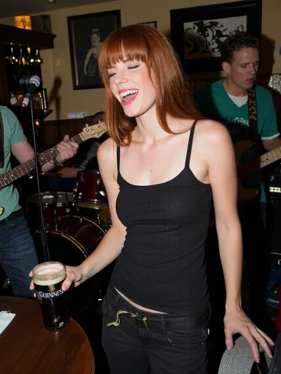 A beautiful Irish woman with ginger red hair, in a lively Irish pub, laughing, dancing to music played by a live band, and drinking a pint of Guinness, and having fun, craic, "the craic was 90"