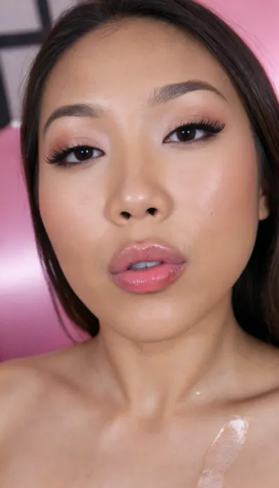 (Pinay Filipina Asian:1.2), (closed mouth), A Filipina's slut face, (27 years old), dark brown tanned skin, (softly overlined lips with muted rosy nude-pink lipstick, (subtle mauve undertones), (slightly deeper pink lip liner defining the edges:1.2), sheer translucent gloss layered over the lipstick, soft reflective highlights on the center of the lips, naturally full-looking lips), (medium-width natural nose), (straight natural nose bridge), (softly rounded slightly bulbous nose tip), (naturally wider nostrils), (subtle nasal width), (nose proportionate to the face), masculine jaw, (softly rounded jawline), (looking straight at camera:1.1), closed lips, (face portrait), (straight frontal shot:1.2), (arrogant expression), (round to softly oval face), natural facial asymmetry, natural facial proportions, realistic skin texture