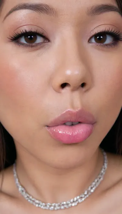 (Pinay Filipina Asian:1.2), (tightly closed mouth:1.2), A Filipina's slut face, (27 years old), dark brown tanned skin, (softly overlined lips with muted rosy nude-pink lipstick, (subtle mauve undertones), (slightly deeper pink lip liner defining the edges:1.2), sheer translucent gloss layered over the lipstick, soft reflective highlights on the center of the lips, naturally full-looking lips), (medium-width natural nose), (straight natural nose bridge), (softly rounded slightly bulbous nose tip), (naturally wider nostrils), (subtle nasal width), (nose proportionate to the face), masculine jaw, (softly rounded jawline), (looking straight at camera:1.1), closed lips, (face portrait), (frontal shot), (round to softly oval face), natural facial asymmetry, natural facial proportions, realistic skin texture