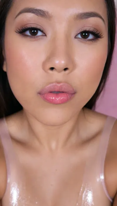 (portrait of a Pinay Filipina Asian:1.2), (tightly closed mouth, lips together:1.3), A Filipina's slut face and shoulders, (27 years old), dark brown tanned skin, (softly overlined lips with muted rosy nude-pink lipstick, (subtle mauve undertones), (slightly deeper pink lip liner defining the edges:1.2), sheer translucent gloss layered over the lipstick, soft reflective highlights on the center of the lips, naturally full-looking lips), (medium-width natural nose), (straight natural nose bridge), (softly rounded slightly bulbous nose tip), (naturally wider nostrils), (subtle nasal width), (nose proportionate to the face), masculine jaw, (softly rounded jawline), (looking straight at camera:1.1), closed lips, (face portrait), (frontal shot), (round to softly oval face), natural facial asymmetry, natural facial proportions, realistic skin texture