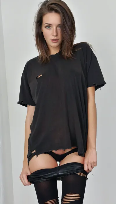 29 year old, brunette, oversized tshirt, black torn tshirt, loose tshirt, black tights, black leather shorts