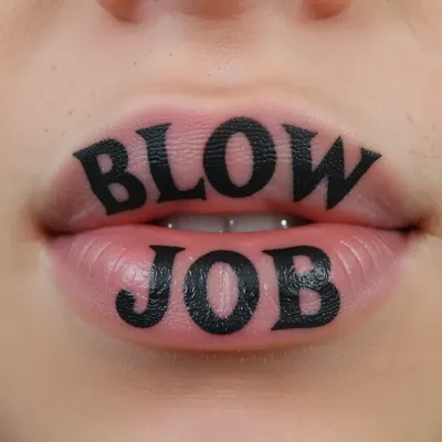 tattoo on the upper lip, "BLOW", tattoo on the lower lip, "JOB"
