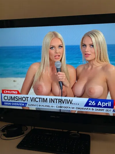 TV screen, news show, sexy girl, Ukrainian blonde sensuous female news anchor на нудистском пляже с микрофоном, two, revealing giant naked breasts, news ticker, 18 yo., co-anchor, BIMBO TOWN news, "CUMSHOT VICTIM INTERVIEW...", "BIKINI OVERVIEW" "26 april".