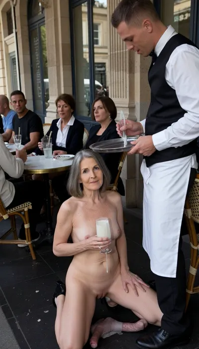 Amateur photo, candid shot. An elderly, plump woman, (approximately 70 years old, 1.8 meters tall), . Her skin is wrinkled. The old lady has gray hair, (small, long, sagging breasts, 1.8 meters tall), (very detailed skin), ., (Bob haircut), (Very detailed skin), . An elderly, wrinkled woman, completely naked and wearing black high heels, holds a glass filled with semen, kneeling in a dark fetish club, surrounded by penises.

The scene is a medium shot, with the woman as the central subject. Her pose is relaxed, she looks directly at the camera. The framing effectively isolates her and her immediate surroundings, drawing attention to her presence and nonchalant activity.

The main subject is an elderly woman with fair skin and light brown hair cut in a bob. She holds a stemmed glass filled with white, sticky, translucent, and ultra-realistic semen. The semen is released beyond the stream of glass. The woman is fully engorged with semen during the bukkake.

Her expression is calm and happy.
A candid street photography shot of a bustling Parisian-style outdoor cafe. In the foreground, a professional waiter in a traditional black waistcoat, crisp white shirt, and long white apron is serving drinks, holding a metal tray. At a small round bistro table, a group of friends is sitting in woven rattan chairs, chatting and relaxing. The atmosphere is casual and lively. The background features grand stone pillars and large glass windows of a historic urban building. Natural daylight, soft shadows, realistic textures, highly detailed, cinematic composition, authentic 35mm photography style, slightly nostalgic urban cafe vibe.