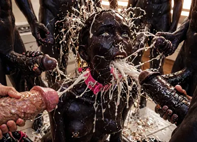 (ultra black skin:4), 20 yo African female, hard pressing massive tits with hands, Nipple and areola visible, maid outfit, kitchen, kneeling, lactation, milk spraying

realistic, ashamed facial expression, pain-distorted facial expression, medium breasts, pink leather corset, blue eyes, anal fuck, rough fuck, painfull fuck, wide pink slave collar, lots of cum on her face, lots of cum on her breasts, hair pulling, living room, leash, bdsm tied up, helpless, bondage, bdsm, pierced nipples, gangbang, (cum explosion from nose:1.64), (cum explosion from mouth:1.85), random sex scene, rapefantasy, Rating_explicit, (score_9, score_8_up, score_7_up, source_bdsmrape:1.12), close up, detailed and infocus face, masterpiece, (perfect lighting:1.4), (skinny:1.4), (ultra detailed face:1.4), (ultra high detailed outfit:1.4), 8k, (high resolution:1.4), (huge dick:2.8), (whip marks:1.5), (whipped tits:1.6), ring gag, (open mouth gag:1.55), (irrumatio:1.6), (6 identical triplet girls, exactly look alike same:1.3), ((analrape spitroast)), ((large cock in mouth:1.12)), (cum explosion from mouth:1.125), (source_bdsmrape:1.48), (hyper massive cock:1.2), of the beast is to big for her little mouth, impossible fit in mouth, looking up, (trying to fit in her mouth the massive cock:1.12), (Tears:2), (bukkake:1.12), (handjob:1.5), above view, cum in mouth, cum on forehead, cum on cheeks, porn photoshoot, (huge dick), (creamy deep deepthroat:1.12), (extreme oral sex:1.4), (huge massive white dick:1.4), (cum), (hands holding hair), (huge dick:1.4), (bukakke), (cum in face, cum on body), (covered in cum), (excessive cum:1.12), (cum on face), (cum on body), (Cum in hair), photorealistic cum, thin runny cum, thick chunky cum bukkake, unwanted bukkake, 4boys, 5boys, 6+boys, multiple black men, Transparent Liquid, orgy, penis, cum, cumbath, <lora:LCMTurboMix_Euler_A_fix:2>, <lora:sd_xl_turbo_lora_v1-64dim:2>, <lora:futureistic_fantasy_anime_sdxl_v1:2>, <lora:Incase_Style__SDXL:2>, <lora:3ll3f4nning:2>