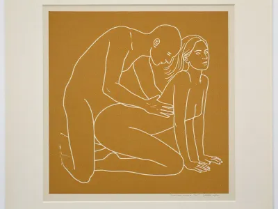 minimalist contemporary figurative screen print, square mustard ochre field centered on a slightly larger pale off white sheet of paper, perfectly frontal reproduction as though photographing a framed or unframed art print straight on, two clearly adult figures, approximately 30 years old, represented exclusively by sparse continuous off white contour lines, intimate but non graphic physical interaction, adult woman positioned on the right in a kneeling all fours pose, knees resting toward the lower center, lower legs extending backward toward the left, arms straight and supporting her upper body, hands placed near the lower right corner, torso gently arched upward, head lifted and turned slightly upward toward the right, long hair suggested with three or four sweeping white lines, second adult figure positioned immediately behind and slightly above her on the left, kneeling upright with torso leaning gently forward, head lowered toward her, arms reaching toward her waist and hips, figures communicating closeness through posture without explicit anatomical detail, facial features reduced to tiny economical marks, absolutely no realistic skin, no shading and no internal modeling, lines approximately uniform in thickness with occasional hand drawn irregularity, muted mustard yellow ochre background with subtle screen print texture, warm ivory white linework, large calm areas of untouched color surrounding the figures, composition centered slightly below the vertical midpoint, recognizable human anatomy simplified into elegant flowing contours, late twentieth century graphic art aesthetic, restrained provocative museum print character, thin pale paper border visible around the mustard square, tiny nearly illegible artist signature near the lower right margin, soft neutral ambient illumination, slight paper texture, perfectly square presentation.
