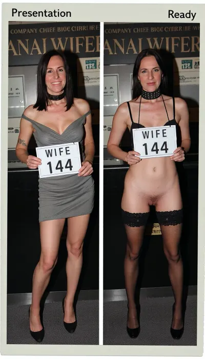 polaroid photo, side-by-side two pictures of the same standing mature slim french gilf 58yo, very sagging skin, (full same body in both pictures), realistic mature skin, woman, medium-lengh straight dark hair, first picture smiling and wearing a sexy everyday dress, in the second picture she is wearing sexy lingerie, pants, bra, stockings, high heels, thick bdsm collar. natural face, In the first picture she is standing and is holding a sign that says "WIFE 144".In the second picture she has hung a sign in her neck that says "WIFE 144" and she has her hands back.Please make an extreme contrast from first picture to second picture. the woman has to be the same woman on both pictures. Background is exactly de same for both pictures, a company chief big office with the word "ANALWIFER" graved on the wall. Her body in both pictures is exactly the same size and form.A caption on the top is written on the first picture 'Presentation'.A caption on the top is written on the first picture 'Ready'.Hard, direct, pop-up style frontal camera flash lighting, creating extreme high contrast between brightly lit foreground subjects and a deeply shadowed, dark background. The skin has a distinct glistening, sweaty-look sheen. Rapid fall-off of light into chaos and darkness in the distance. Retro flash color rendering with harsh highlights and potential red-eye effect, pussy exposed