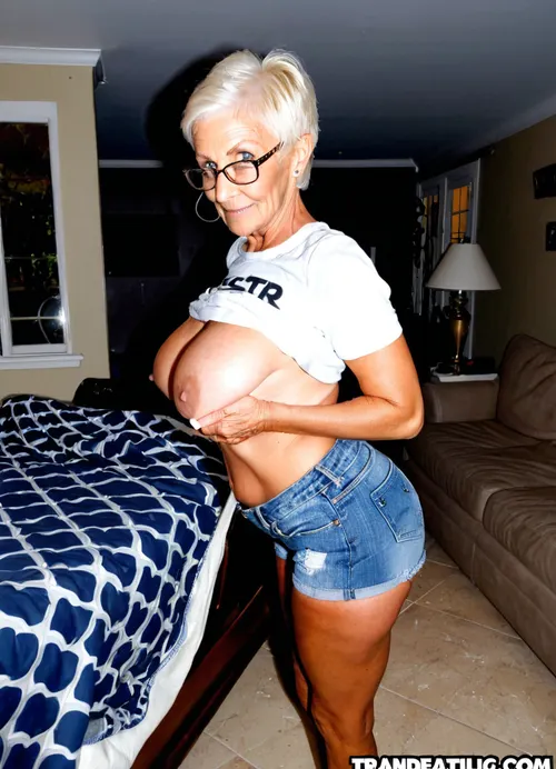 Very busty skinny tanned grandmother, quilting a blanket, sewing machine, extra large round perfect siliconed boobs, huge massive round tits, real gorgeous granny style, tiny jeans shorts, old décor living room, old lady shirt, pornstar, original suggestive spreading pose
High detailed photo, high quality photo, from the side, long brown hair