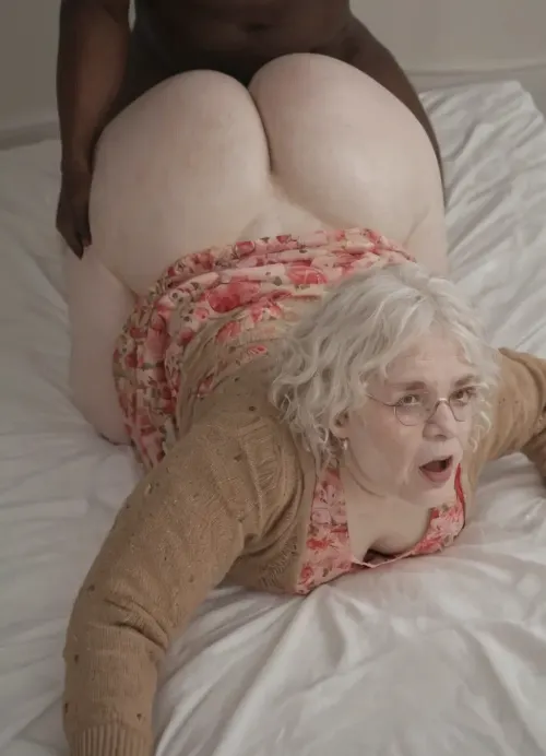 (Ssbbw:1.3), (chubby 30 year old woman:1.8), (white skin:1.8), in, (bed:1.3), (She has short curly white hair:1.4), (glasses:1.1), (brown cardigan pink floral dress:1.4), ., (She is screaming:1.3), (Interracial ass up doggystyle:1.2), (Big ass Wide hips big thighs:1.3), (3/4 view:1.3), (man holding her hips:1.2), . Looking at viewer. On all fours.