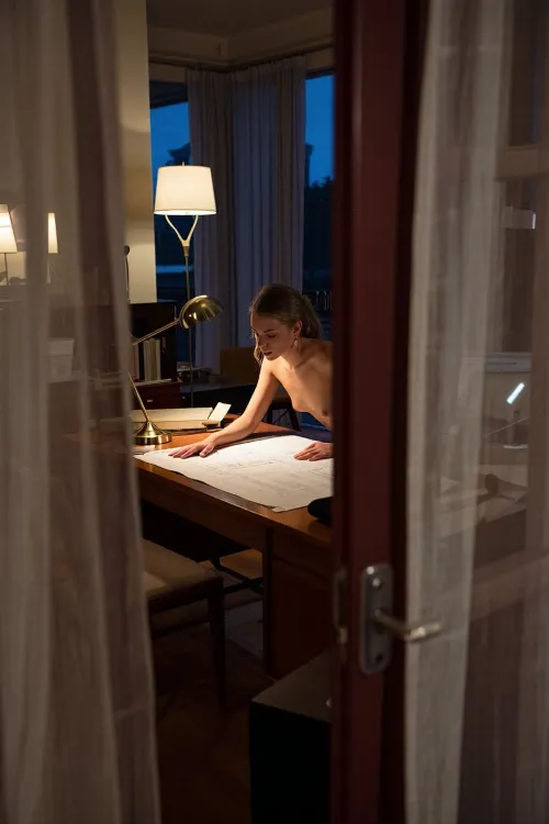 Through velvet curtains: a midnight architect’s unseen moment