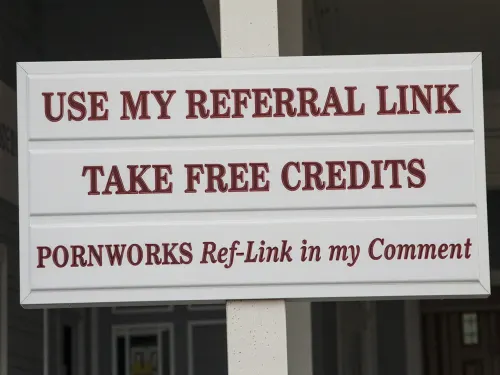a clean white sign mounted on a simple white post, In elegant metallic red lettering, the sign clearly reads in the first line, USE MY REFERRAL LINK, in the second line, TAKE FREE CREDITS, in the third line, PORNWORKS Ref-Link in my Comment, The typography is crisp, centered, highly legible, and realistically printed on the white surface.