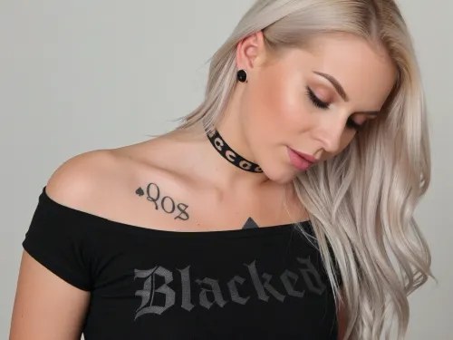 A black top with Blacked written on it, QOS choker, spades tattoo, spades earrings, blonde bleached German woman, 30yo, long hair.