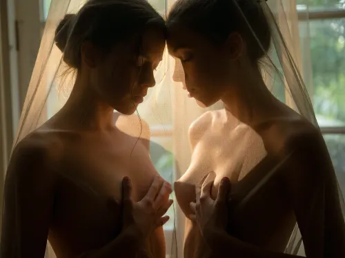 Fine art cinematic photography, Francesca Woodman aesthetic, extreme soft focus, heavy analog grain, Kodak Portra 800 pushed two stops, warm amber and deep shadow, the blur the primary mood of the image.

Close=up on tiny breasts, Two very yyoung woman behind a sheer curtain, touching her tiny breasts, her form entirely dissolved through the gauze, dark hair loosely pinned, the curtain between the viewer and the figure absolute, she exists as suggestion rather than subject.

A soft golden backlight through the curtain, the light through the sheer fabric in warm amber and gold, the curtain catching and diffusing the light into something molten, deep shadow at the edges consuming the frame. A rustic window barely visible behind sheer curtains. Extreme soft focus throughout, nothing sharp anywhere in the frame, the woman dissolved into light and gauze and grain, warm amber and deep green shadow, intimate and voyeuristic, glimpsed not seen, the curtain keeping its secret.