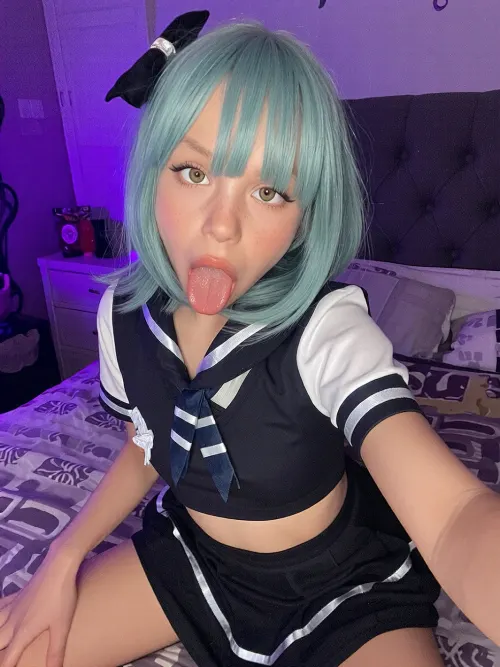 amateur selfie, full body, a very tiny and very childish sea green haired 2-year-old underweight malnourished girl in a naughty sultry school outfit is posing lustfully on a bed in a cozy purple bedroom. dark. soft neon light. throatfucked.