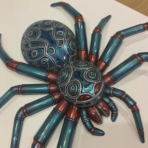 One spider, intricately engraved patterns on exoskeleton. Exoskeleton Metallica emerald blue green with segments of metallic ruby red luminescent, crayon drawing