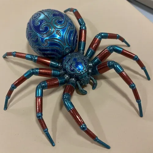 One spider, intricately engraved patterns on exoskeleton. Exoskeleton Metallica emerald blue green with segments of metallic ruby red luminescent, crayon drawing