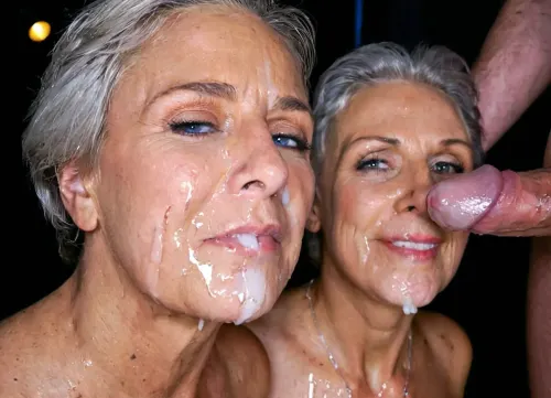 Duo of naked grannies gets their faces covered with sperm, real ordinary grandmother, perfect granny's face, cumshot, cum jet, spurt of sperm, facial cumshot, bukkake, shaved short haircut, dark room, flash lights High detailed photo, high quality photo, close-up, close