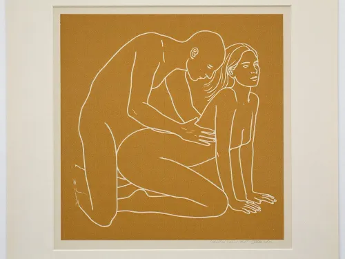 minimalist contemporary figurative screen print, square mustard ochre field centered on a slightly larger pale off white sheet of paper, perfectly frontal reproduction as though photographing a framed or unframed art print straight on, two clearly adult figures, approximately 30 years old, represented exclusively by sparse continuous off white contour lines, intimate but non graphic physical interaction, adult woman positioned on the right in a kneeling all fours pose, knees resting toward the lower center, lower legs extending backward toward the left, arms straight and supporting her upper body, hands placed near the lower right corner, torso gently arched upward, head lifted and turned slightly upward toward the right, long hair suggested with three or four sweeping white lines, second adult figure positioned immediately behind and slightly above her on the left, kneeling upright with torso leaning gently forward, head lowered toward her, arms reaching toward her waist and hips, figures communicating closeness through posture without explicit anatomical detail, facial features reduced to tiny economical marks, absolutely no realistic skin, no shading and no internal modeling, lines approximately uniform in thickness with occasional hand drawn irregularity, muted mustard yellow ochre background with subtle screen print texture, warm ivory white linework, large calm areas of untouched color surrounding the figures, composition centered slightly below the vertical midpoint, recognizable human anatomy simplified into elegant flowing contours, late twentieth century graphic art aesthetic, restrained provocative museum print character, thin pale paper border visible around the mustard square, tiny nearly illegible artist signature near the lower right margin, soft neutral ambient illumination, slight paper texture, perfectly square presentation.