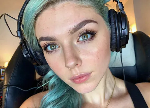 (18 Year old gamer girl:2), (headphones, twitch streamer, sitting in a gamer chair:1.5), (Irish, pale skin, freckles, freckles on face), (web cam snapshot, portrait, face portrait with emphasis on her eyes, close up of face, fisheye lens:1.5), (ring lighting, ringing lighting reflected in eyes), (Scandinavian and Irish features), (photorealistic, photo realistic, photorealism, photo realism:1.8), (4k, 8k, 8k resolution, best quality, ultra quality, highest quality, maximum quality, uncompressed, raw source photograph:1.2), (same color eyes, symmetric eyes, matching eyes, detailed eyes, detailed iris, detailed pupils, limbal ring around iris, perfectly round iris, perfectly round pupils:1.4), (detailed skin, high detailed skin, intricately detailed skin, perfectly detailed skin, high quality skin, highest quality skin, exquisitely textured skin), (intricate clothing, detailed clothing), (microblade eyebrows, perfectly manicured eyebrows), (flushed cheeks, flushed neck, blushing cheeks, blushing neck), (overfilled lips, juicy lips, filled lips, puffy lips, glossy lips, her thick wet lips are slightly parted, nervously biting lower lip, lip bite, lip biting), (casual makeup, subtle makeup, natural makeup), (narrow jaw, delicate jawline, pointed jaw and chin, heart shaped face, pixie face, fairy face, fae features, extremely feminine face, round face, chin, mouth, high cheekbones, sharp cheekbones, faint vellus hairs, cute tall tall tall dimpled cheeks), (upturned button nose, upturned nose, delicate nose, nose), (cute tall pixiecut hair framing her face, messy hair, tousled hair, bed hair, sex hair, blue hair with dark roots), (eyes slightly crossed, big eyes, wide eyes, doe eyes, slightly wide set eyes), (striking eyes, captivating eyes, mesmerizing eyes, fae eyes), (pale green eyes with golden flecks), (huge breasts, large breasts, large natural breasts), (athletic body, sporty body, lean body, muscular body, muscle shoulders, defined shoulders, rock climber body), (close up portrait of face, tight closeup of face, closely zoomed in on face, tight in on face, extreme closeup), (looking straight into the camera, looking straight ahead, head slightly raised, gazing lovingly straight into the camera, looking down on her from above), (she's in love, adoring gaze), (no nudes, nonnude), (relaxed posture, casual pose, casual outfit, casual attire, casual underwear), (loving expressing, adoring expression, joyous, joyful, pleased), (girlfriend, girlfriend material, girlfriend experience)