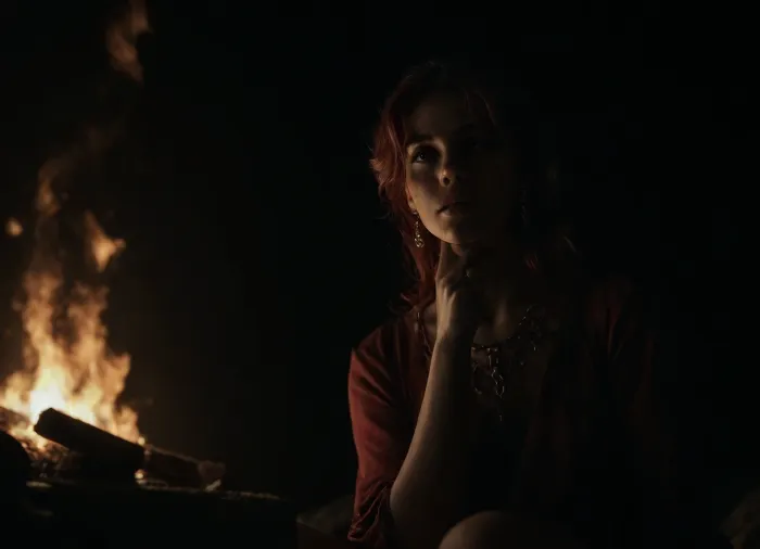 (score_7_up, score_8_up, score_9, 1girl, solo, masterpiece), (eerie portrait of a gorgeous Irish woman sitting by a campfire and telling stories:1.2), (focus on face, fire light, red hair, Irish features:1.4), (low angle view, linear perspective, dutch angles), sultry, seductive, seducing, alluring, intimate, sexual, horny, insatiable, lustful, erotica, irresistible, (black background, camp fire:1.5), ziprealism, <lora:dark:1>